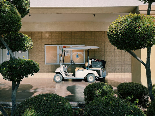 a golf cart parked in front of a building